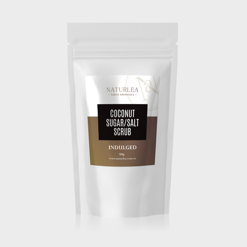 Naturlea Indulged Coconut Sugar and Salt Scrub 500g Pouch on Grey Background. Your time to rejuvenate. 100% Australian Made.